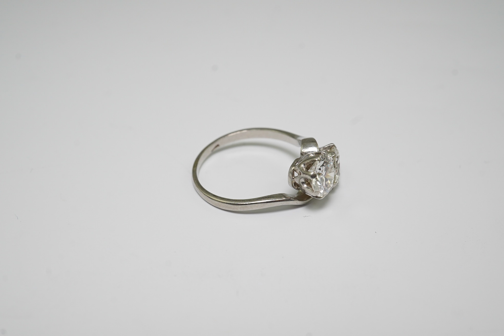 A platinum? and two stone diamond set crossover ring